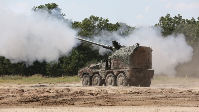 Image of the Remote-Controlled Howitzer 155mm (RCH 155) 52 calibre wheeled artillery system. Seen here at a military training area in Germany. The criticality of artillery fire has never been clearer. Automated artillery systems have packed a powerful punch on the battlefield in Ukraine, and RCH 155 will provide a modernised capability unparalleled in other artillery systems. RCH 155 delivers increased range and accuracy for artillery engagements, a high rate-of-fire of up to nine rounds-per-minute and possesses a powerful blend of tactical and operational mobility. Able to deliver multiple rounds onto a target simultaneously in a 360-degree arc at range, it also has a direct fire capability providing close range defence. As part of the Boxer family, it uses the common Boxer drive module, creating efficiencies in support through platform commonality and modularity, and improving interoperability.