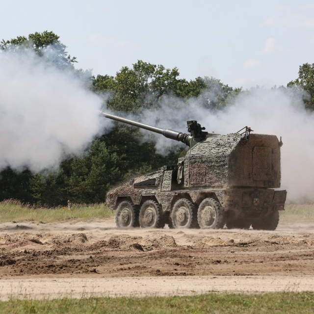 Image of the Remote-Controlled Howitzer 155mm (RCH 155) 52 calibre wheeled artillery system. Seen here at a military training area in Germany. The criticality of artillery fire has never been clearer. Automated artillery systems have packed a powerful punch on the battlefield in Ukraine, and RCH 155 will provide a modernised capability unparalleled in other artillery systems. RCH 155 delivers increased range and accuracy for artillery engagements, a high rate-of-fire of up to nine rounds-per-minute and possesses a powerful blend of tactical and operational mobility. Able to deliver multiple rounds onto a target simultaneously in a 360-degree arc at range, it also has a direct fire capability providing close range defence. As part of the Boxer family, it uses the common Boxer drive module, creating efficiencies in support through platform commonality and modularity, and improving interoperability.