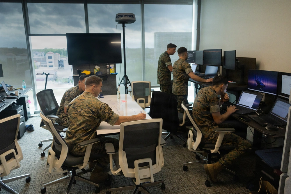 U.S. Marines with the Marine Corps Software Factory (MCSWF) and the Marine Innovation Unit (MIU) update and debug software at MCSWF in Austin, Texas, March 26, 2026. 