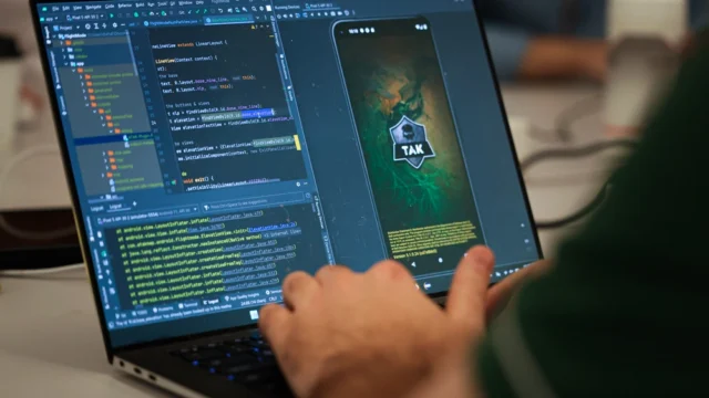 U.S. Marine Corps Capt. David Whalen, assigned to the Marine Innovation Unit (MIU), Marine Forces Reserve, works on developing a “Flight Mode” software feature at the Marine Corps Software Factory (MCSWF) in Austin, Texas, 17 - 29 March, 2025.