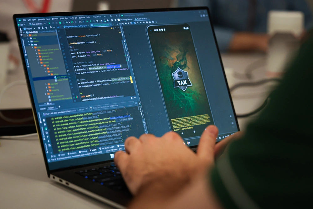 U.S. Marine Corps Capt. David Whalen, assigned to the Marine Innovation Unit (MIU), Marine Forces Reserve, works on developing a “Flight Mode” software feature at the Marine Corps Software Factory (MCSWF) in Austin, Texas, 17 - 29 March, 2025.