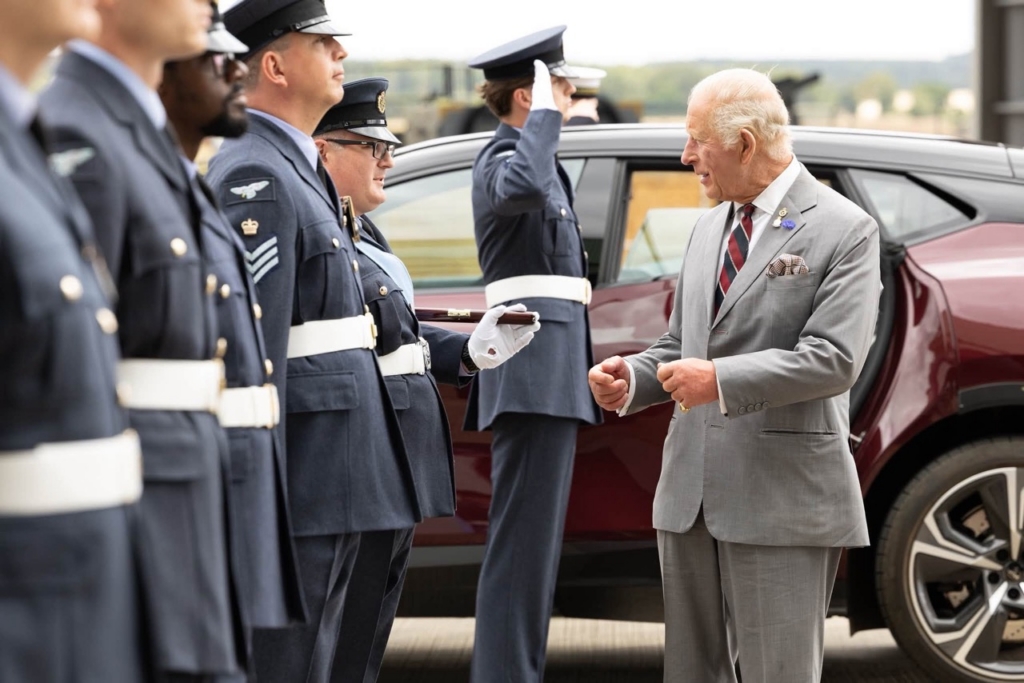 King Charles visits RAF Marham, arrives at the hangar and talks to service personel, and families. RAF Marham is the home of the F-35B Lightning, a 5th Generation, multi-role, stealth fighter. The Station is also home to a range of engineering support functions from maintenance to frontline support.