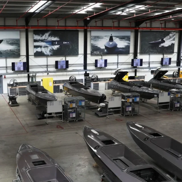 Kraken Technology's workshop showing rows of drone boats