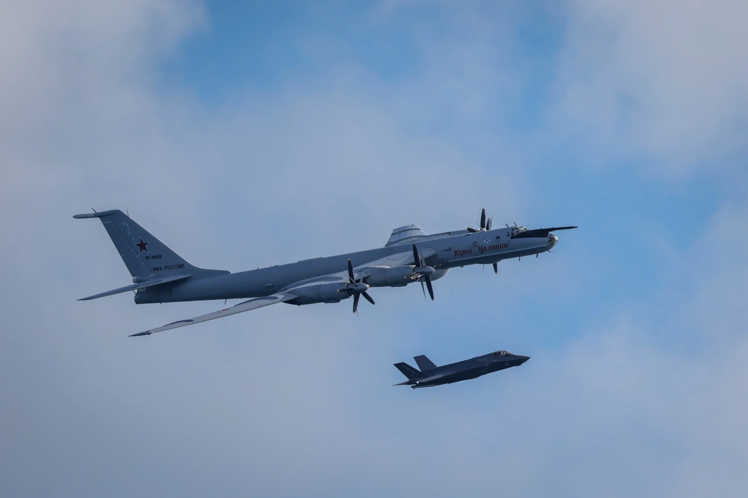 Russian Tu-142 maritime patrol aircraft and British F-35B