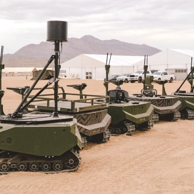 Five of the eight ARX Robotics-made GEREON UGVs are seen on the ground at Fort Irwin, California, during the PC-C6 trial that was held in July 2026. Note that each of these UGVs is configured for a different mission set. Image: ARX Robotics