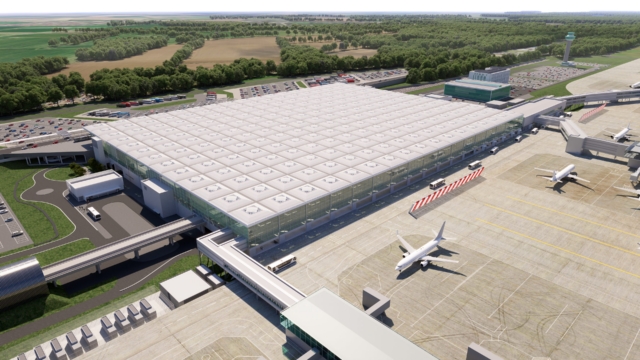 Stansted transformation. Aerial view of skylinks connecting to extended terminal building.