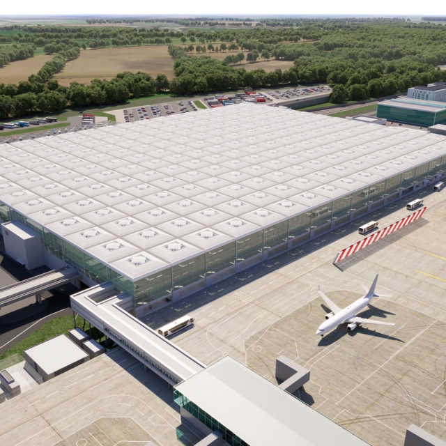 Stansted transformation. Aerial view of skylinks connecting to extended terminal building.