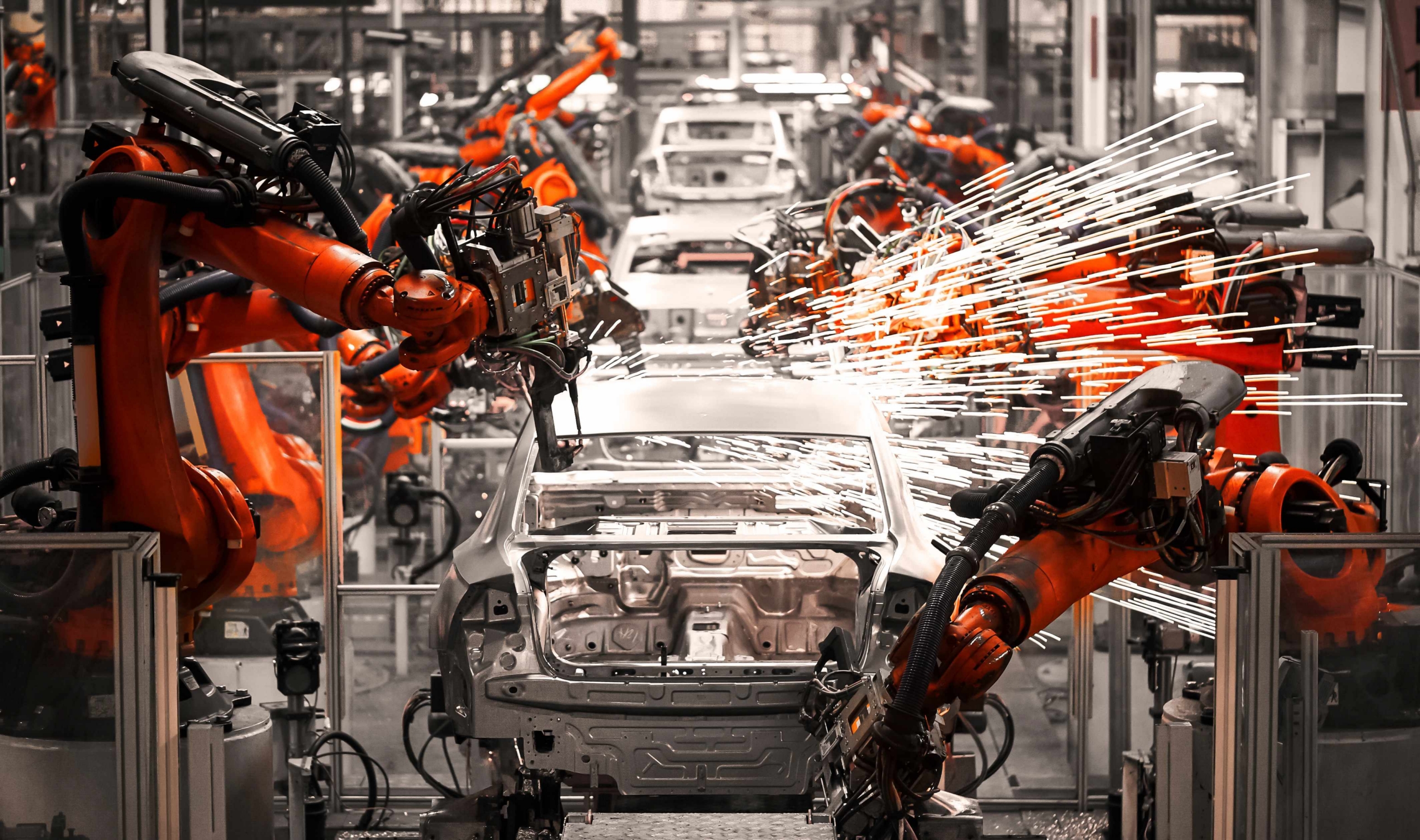 A robotic arm of the car production plant is working as UK automotive suppliers ask for help to secure defence contracts.