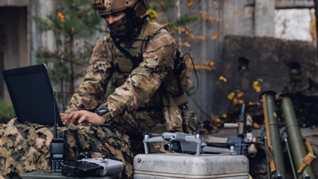 Ukraine soldier sets up a drone to use on the battlefield