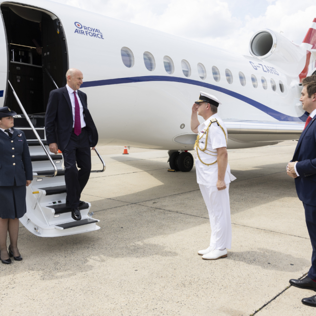 John Healey stepping off a private jet