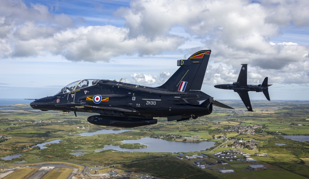 A pair of RAF Hawk T2s fly over RAF Valley, Anglesey, on 5 July 2024. Image: MOD Crown Copyright/AS1 Alex Naughalty