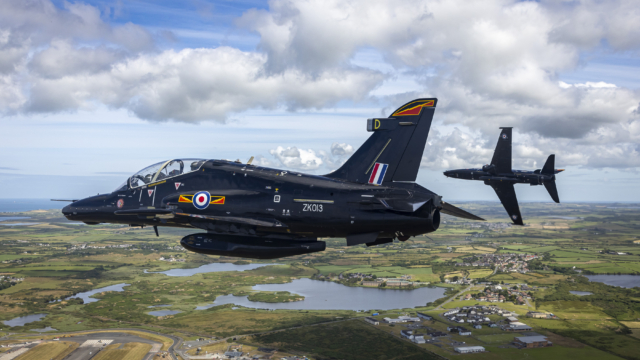 A pair of RAF Hawk T2s fly over RAF Valley, Anglesey, on 5 July 2024. Image: MOD Crown Copyright/AS1 Alex Naughalty
