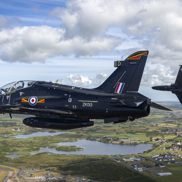 A pair of RAF Hawk T2s fly over RAF Valley, Anglesey, on 5 July 2024. Image: MOD Crown Copyright/AS1 Alex Naughalty