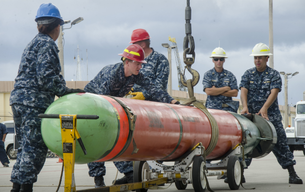 US Navy sailors prepare to load a Mk 48 heavyweight torpedo onto the Emory S Land-class submarine tender, USS Frank Cable (AS-40), at Santa Rita in Guam on 10 February 2017. Image: US Navy/Mass Communication Specialist 3rd Class Alana Langdon
