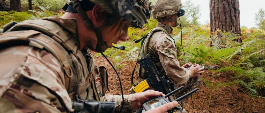 A Royal Tank Regiment commander views live feed as an FPV drone pilot flew over an enemy target during 'Drone Wars' competition. Image: MOD Crown Copyright/British Army