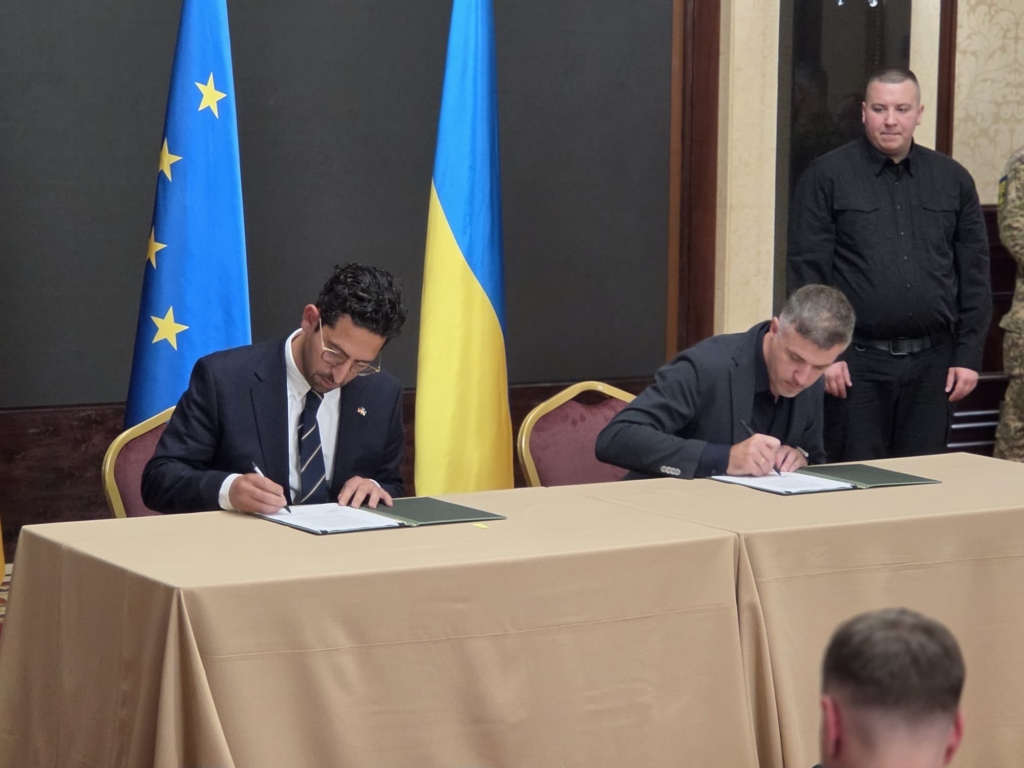 ARX Robotics and Roboneers signing partnership agreement in Kyiv.