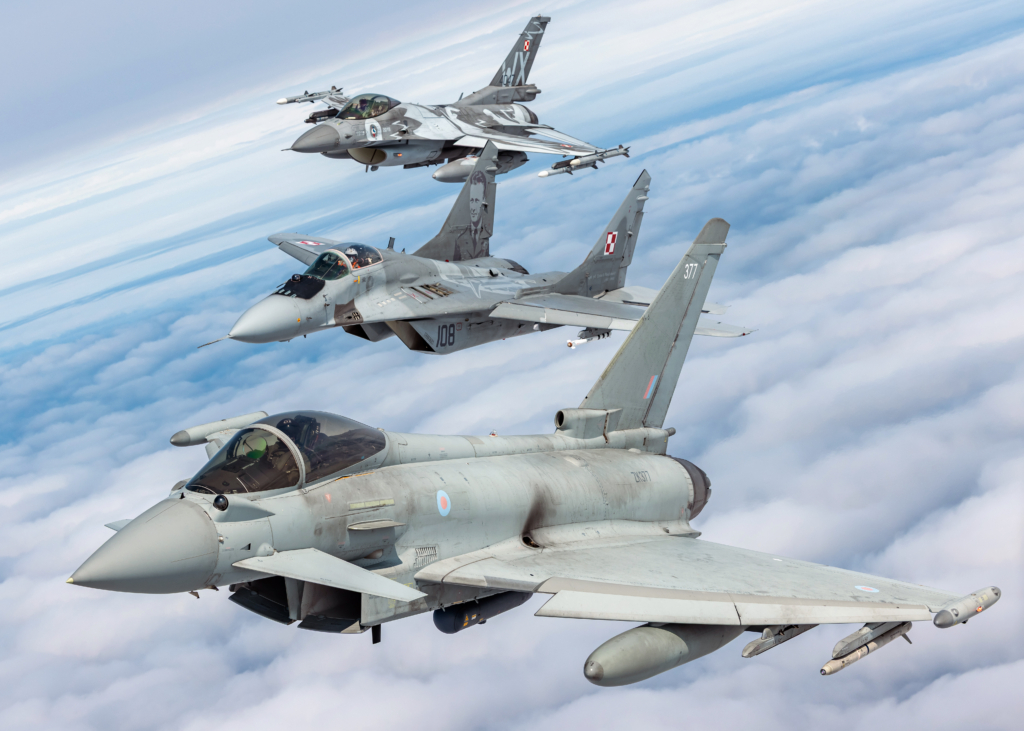 An RAF Typhoon FGR4 flies in formation with a Polish Air Force-operated MiG-29 Fulcrum and F-16C Fighting Falcon during Operation Chessman on 11 June 2025. Image: MOD Crown Copyright/Cpl Jake Hobbs